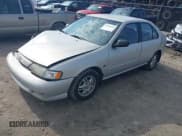 ✅ 1999 Nissan Sentra XE • VIN: 3N1AB41D4XL092799 • Lot: 42696558. Wystawiony na IAAI z przebiegiem 143 009 mil. Bezpłatny archiwum sprzedaży aukcyjnych z USA i szczegółowy raport historii pojazdu na DreamBid. Zdjęcie 2.