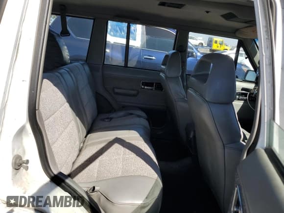 ✅ 1990 Jeep Cherokee Laredo • VIN: 1J4FJ58L3LL206400 • Лот: 73701784. Опубликован ранее на Copart с пробегом 205 067 миль. Бесплатный доступ к архиву аукционных продаж из США и подробный отчёт об истории автомобиля на DreamBid. Изображение 11.