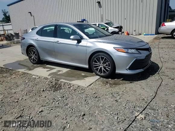 2023 Toyota Camry Hybrid XLE with VIN 4T1F31AK3PU600873, listed as a Copart auction lot 69192335 with 9,606 mi miles and Salvage title. Bid and sale history available at DreamBid. Image 13.