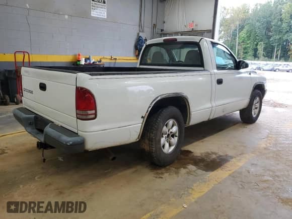 2003 Dodge Dakota z VIN 1D7FL16X73S307529, wystawiony jako Copart lot #73568784 z przebiegiem 314 924 mil mil oraz Szkoda całkowita • Salvage title. Historia ofert i sprzedaży dostępna na DreamBid. Obrazek 3.