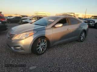 2013 Hyundai Azera z VIN KMHFH4JG9DA207438, wystawiony jako Copart lot #89026555 z przebiegiem 137 077 mil mil oraz Szkoda całkowita • Salvage title. Historia ofert i sprzedaży dostępna na DreamBid. Obrazek 1.