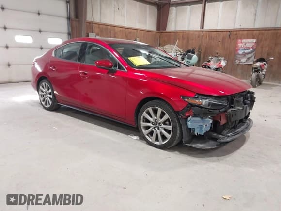 ✅ 2021 Mazda 3 • VIN: JM1BPBDL0M1334811 • Lot: 43777630. Listed on IAAI with 57,584 mi. Free auction sales archive from the USA and detailed vehicle history report at DreamBid. Image 1.