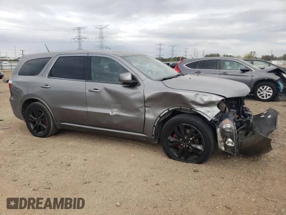2012 Dodge Durango R/T with VIN 1C4SDJCT2CC147237, listed as a Copart auction lot 82385265 with 174,990 mi miles and Salvage title. Bid and sale history available at DreamBid. Image 4.