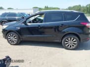 ✅ 2018 Ford Escape Titanium • VIN: 1FMCU9J9XJUA58366 • Lot: 42941884. Listed on IAAI with 157,052 mi. Free auction sales archive from the USA and detailed vehicle history report at DreamBid. Image 14.