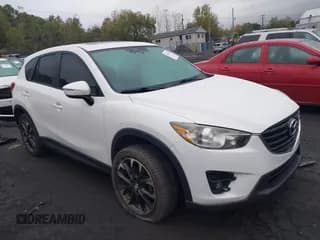 ✅ 2016 Mazda CX-5 Grand Touring • VIN: JM3KE4DY5G0760878 • Lot: 43450576. Wystawiony na IAAI z przebiegiem 143 780 mil. Bezpłatny archiwum sprzedaży aukcyjnych z USA i szczegółowy raport historii pojazdu na DreamBid. Zdjęcie 1.