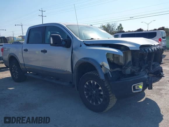 ✅ 2018 Nissan Titan Pro-4X • VIN: 1N6AA1E51JN551695 • Lot: 43365881. Listed on IAAI with 114,790 mi. Free auction sales archive from the USA and detailed vehicle history report at DreamBid. Image 1.