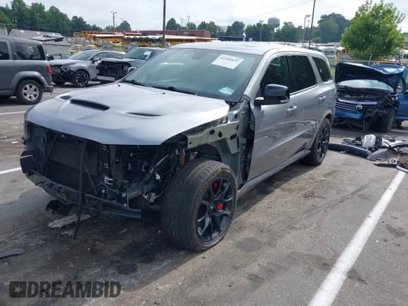 2021 Dodge Durango R/T with VIN 1C4SDJCT6MC879260, listed as a IAAI auction lot 42709837 with 59,646 mi miles and . Bid and sale history available at DreamBid. Image 2.