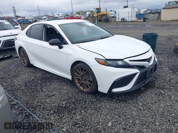 2023 Toyota Camry SE with VIN 4T1G11BKXPU103277, listed as a IAAI auction lot 41978396 with 66,624 mi miles and . Bid and sale history available at DreamBid. Image 1.