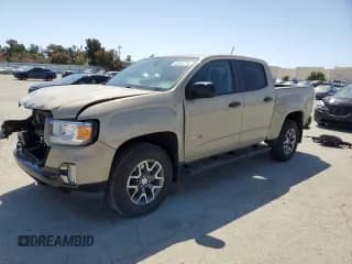 ✅ 2021 GMC Canyon 4WD AT4 • VIN: 1GTG6FEN5M1179284 • Лот: 52053775. Опубликован ранее на Copart с пробегом 60 316 миль. Бесплатный доступ к архиву аукционных продаж из США и подробный отчёт об истории автомобиля на DreamBid. Изображение 1.