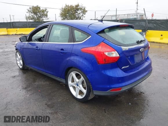 ✅ 2014 Ford Focus Titanium • VIN: 1FADP3N23EL139365 • Lot: 43758493. Listed on IAAI with 96,300 mi. Free auction sales archive from the USA and detailed vehicle history report at DreamBid. Image 3.