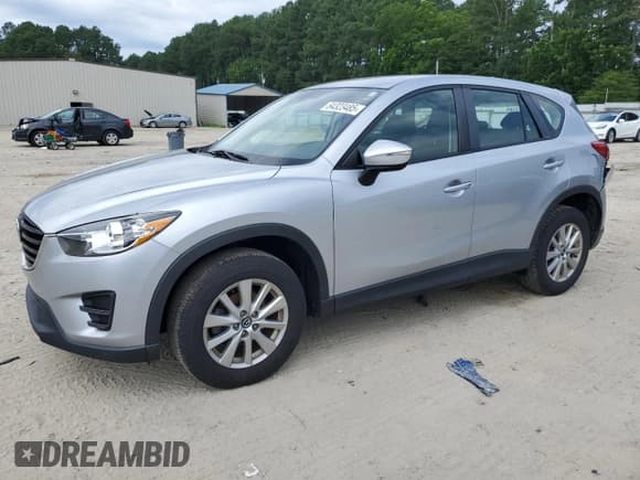 ✅ 2016 Mazda CX-5 Sport • VIN: JM3KE4BY4G0899726 • Лот: 64323485. Опубликован ранее на Copart с пробегом 90 629 миль. Бесплатный доступ к архиву аукционных продаж из США и подробный отчёт об истории автомобиля на DreamBid. Изображение 1.