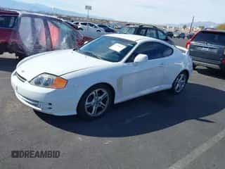 2004 Hyundai Tiburon GT z VIN KMHHN65FX4U130771, wystawiony jako IAAI lot #41754074 z przebiegiem 126 711 mil mil oraz . Historia ofert i sprzedaży dostępna na DreamBid. Obrazek 2.