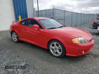 2004 Hyundai Tiburon GT z VIN KMHHN65F24U142204, wystawiony jako Copart lot #50347055 z przebiegiem 128 040 mil mil oraz Czysty tytuł • Clean title. Historia ofert i sprzedaży dostępna na DreamBid. Obrazek 4.