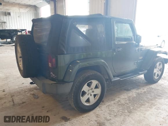 ✅ 2007 Jeep Wrangler Sahara • VIN: 1J4FA54187L125547 • Lot: 43487962. Listed on IAAI with 187,902 mi. Free auction sales archive from the USA and detailed vehicle history report at DreamBid. Image 4.