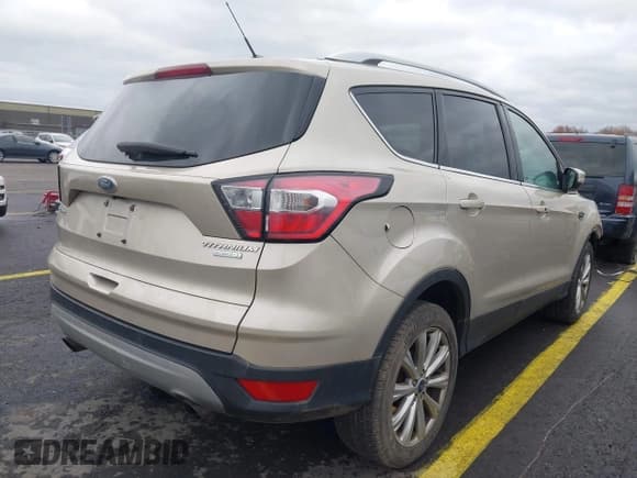 ✅ 2017 Ford Escape Titanium • VIN: 1FMCU0JD0HUE15077 • Lot: 43797538. Wystawiony na IAAI z przebiegiem 90 631 mil. Bezpłatny archiwum sprzedaży aukcyjnych z USA i szczegółowy raport historii pojazdu na DreamBid. Zdjęcie 4.