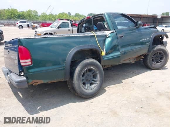 2001 Dodge Dakota Sport z VIN 1B7GG26N11S149189, wystawiony jako IAAI lot #42435137 z przebiegiem 152 363 mil mil oraz . Historia ofert i sprzedaży dostępna na DreamBid. Obrazek 4.