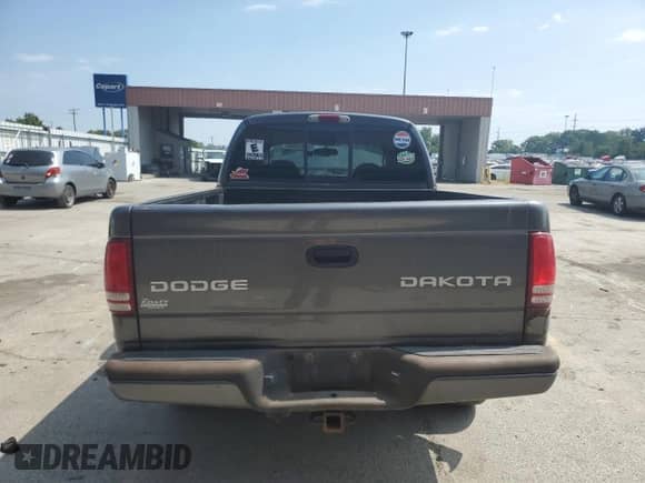 2003 Dodge Dakota Sport z VIN 1D7HG38N93S323350, wystawiony jako Copart lot #68911784 z przebiegiem 137 395 mil mil oraz Czysty tytuł • Clean title. Historia ofert i sprzedaży dostępna na DreamBid. Obrazek 6.