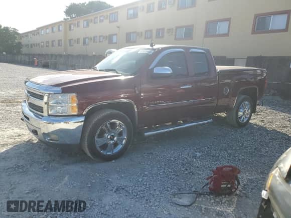 2013 Chevrolet Silverado 1500 LT with VIN 1GCRCSE05DZ261175, listed as a Copart auction lot 87035465 with 203,169 mi miles and Salvage title. Bid and sale history available at DreamBid. Image 1.