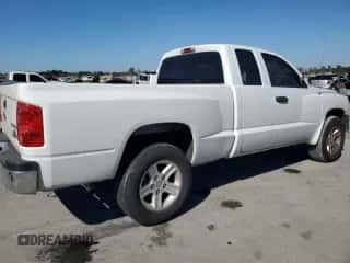 2010 Dodge Dakota z VIN 1D7CE3BK1AS151164, wystawiony jako Copart lot #75810744 z przebiegiem 252 859 mil mil oraz Szkoda całkowita • Salvage title. Historia ofert i sprzedaży dostępna na DreamBid. Obrazek 3.