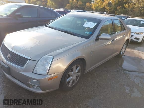 ✅ 2006 Cadillac STS • VIN: 1G6DW677460111457 • Lot: 43726542. Listed on IAAI with 106,299 mi. Free auction sales archive from the USA and detailed vehicle history report at DreamBid. Image 2.