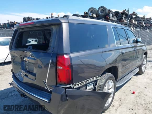 2017 Chevrolet Suburban Premier with VIN 1GNSKJKC1HR403063, listed as a IAAI auction lot 43092501 with 163,931 mi miles and . Bid and sale history available at DreamBid. Image 4.