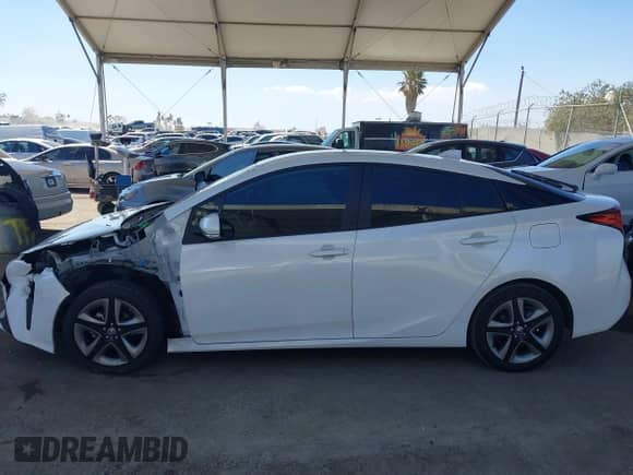 2021 Toyota Prius L Eco with VIN JTDKAMFU4M3134943, listed as a IAAI auction lot 43175713 with 106,611 mi miles and . Bid and sale history available at DreamBid. Image 15.