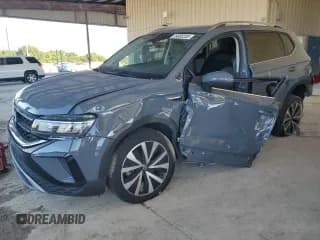 ✅ 2023 Volkswagen Taos SE • VIN: 3VVEX7B2XPM381163 • Lot: 89885205. Listed on Copart with 28,594 mi. Free auction sales archive from the USA and detailed vehicle history report at DreamBid. Image 1.
