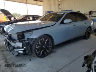 ✅ 2024 BMW i5 eDrive40 • VIN: WBY33FK04RCS32129 • Lot: 84874825. Listed on Copart with 11,356 mi. Free auction sales archive from the USA and detailed vehicle history report at DreamBid. Image 1.