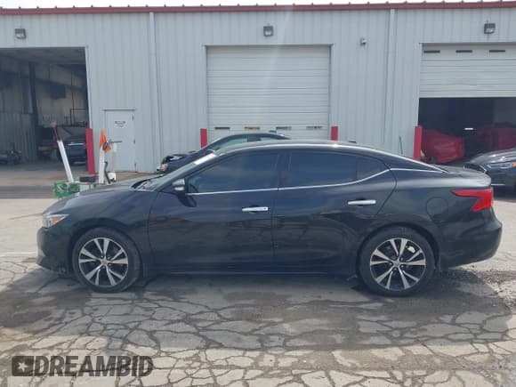 ✅ 2018 Nissan Maxima S • VIN: 1N4AA6AP0JC404793 • Lot: 43289784. Listed on IAAI with 111,792 mi. Free auction sales archive from the USA and detailed vehicle history report at DreamBid. Image 14.