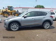 ✅ 2015 Mazda CX-5 Grand Touring • VIN: JM3KE4DY9F0517346 • Lot: 42837462. Listed on IAAI with 124,004 mi. Free auction sales archive from the USA and detailed vehicle history report at DreamBid. Image 14.