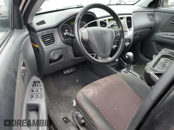 ✅ 2009 Kia Rio SX • VIN: KNADE243596471233 • Lot: 68736765. Listed on Copart with 140,498 mi. Free auction sales archive from the USA and detailed vehicle history report at DreamBid. Image 8.