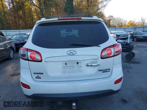 ✅ 2011 Hyundai Santa Fe Limited • VIN: 5XYZKDAG2BG090866 • Lot: 77454264. Listed on Copart with 90,827 mi. Free auction sales archive from the USA and detailed vehicle history report at DreamBid. Image 6.