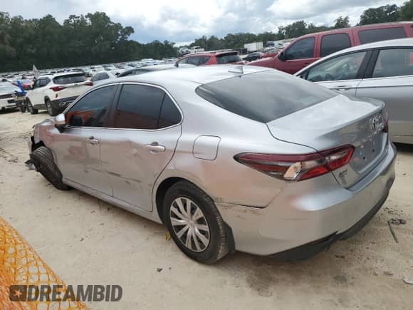 2021 Toyota Camry Hybrid LE with VIN 4T1C31AK7MU562031, listed as a Copart auction lot 71506375 with 82,877 mi miles and Salvage title. Bid and sale history available at DreamBid. Image 2.
