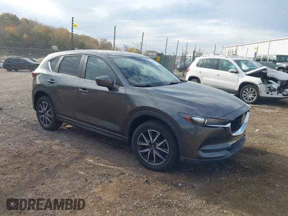 ✅ 2018 Mazda CX-5 Touring • VIN: JM3KFBCM3J0398105 • Lot: 43609194. Wystawiony na IAAI z przebiegiem 64 706 mil. Bezpłatny archiwum sprzedaży aukcyjnych z USA i szczegółowy raport historii pojazdu na DreamBid. Zdjęcie 1.