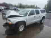 2003 Dodge Dakota Sport z VIN 1D7HG38N83S265442, wystawiony jako Copart lot #84969985 z przebiegiem Nie podano mil oraz Szkoda całkowita • Salvage title. Historia ofert i sprzedaży dostępna na DreamBid. Obrazek 1.