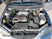 ✅ 2001 Mazda Protege DX • VIN: JM1BJ222210417508 • Lot: 83482064. Listed on Copart with Not provided. Free auction sales archive from the USA and detailed vehicle history report at DreamBid. Image 11.