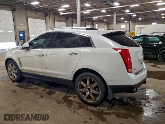 ✅ 2012 Cadillac SRX Premium Collection • VIN: 3GYFNCE39CS561384 • Lot: 96707565. Wystawiony na Copart z przebiegiem 180 316 mil. Bezpłatny archiwum sprzedaży aukcyjnych z USA i szczegółowy raport historii pojazdu na DreamBid. Zdjęcie 2.