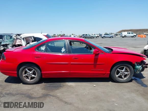 ✅ 2002 Pontiac Grand Prix GT • VIN: 1G2WP52K32F176630 • Lot: 42713686. Wystawiony na IAAI z przebiegiem 183 147 mil. Bezpłatny archiwum sprzedaży aukcyjnych z USA i szczegółowy raport historii pojazdu na DreamBid. Zdjęcie 14.