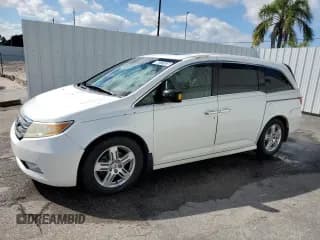 ✅ 2012 Honda Odyssey Touring • VIN: 5FNRL5H94CB025228 • Lot: 90727425. Listed on Copart with 181,427 mi. Free auction sales archive from the USA and detailed vehicle history report at DreamBid. Image 1.