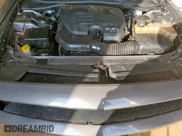 2018 Dodge Challenger SXT z VIN 2C3CDZAG7JH303067, wystawiony jako Copart lot #85004405 z przebiegiem 143 762 mil mil oraz Czysty tytuł • Clean title. Historia ofert i sprzedaży dostępna na DreamBid. Obrazek 11.