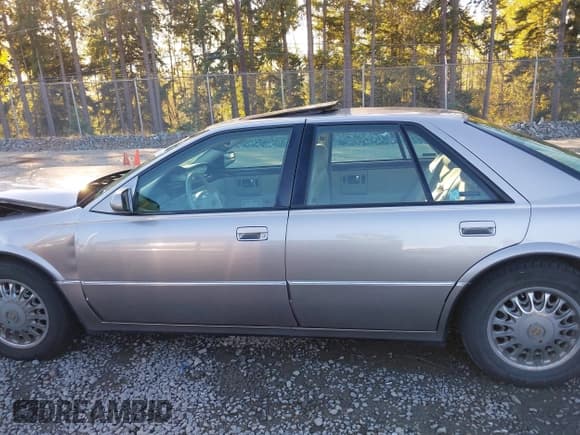 ✅ 1997 Cadillac Seville STS • VIN: 1G6KY5298VU810473 • Lot: 43444629. Listed on IAAI with 71,575 mi. Free auction sales archive from the USA and detailed vehicle history report at DreamBid. Image 14.