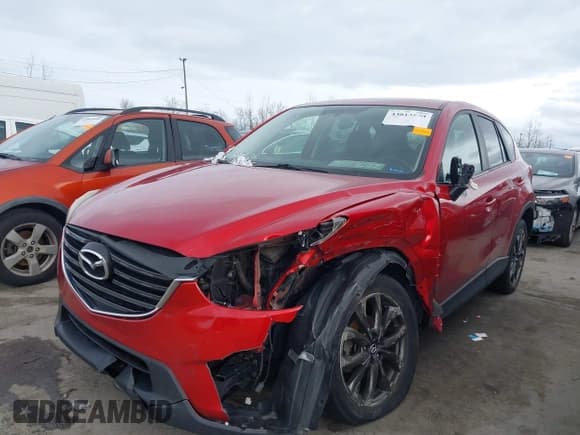 ✅ 2016 Mazda CX-5 Grand Touring • VIN: JM3KE4DY6G0782419 • Lot: 43813550. Wystawiony na IAAI z przebiegiem 122 952 mil. Bezpłatny archiwum sprzedaży aukcyjnych z USA i szczegółowy raport historii pojazdu na DreamBid. Zdjęcie 16.