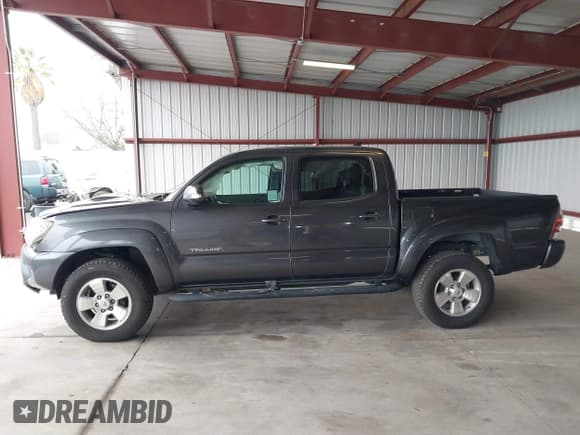 ✅ 2015 Toyota Tacoma • VIN: 3TMLU4EN6FM198795 • Lot: 41612057. Listed on IAAI with 103,001 mi. Free auction sales archive from the USA and detailed vehicle history report at DreamBid. Image 15.
