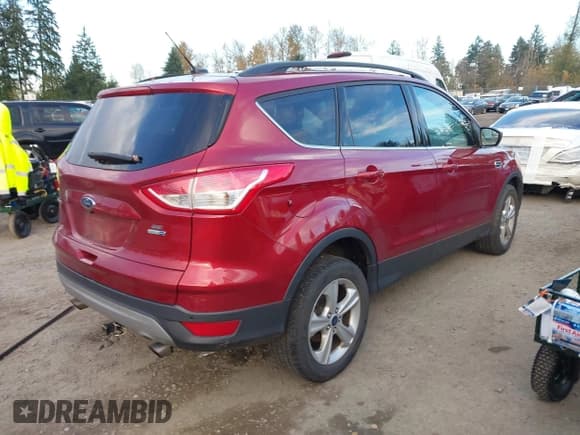 ✅ 2016 Ford Escape SE • VIN: 1FMCU9GX1GUC12512 • Lot: 43757850. Listed on IAAI with 103,064 mi. Free auction sales archive from the USA and detailed vehicle history report at DreamBid. Image 4.