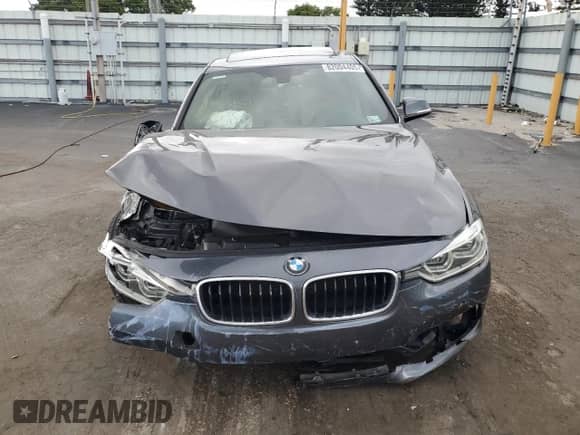 2018 BMW 3 Series 330i xDrive with VIN WBA8D9G57JNU70847, listed as a Copart auction lot 82004405 with 106,746 mi miles and Salvage title. Bid and sale history available at DreamBid. Image 5.