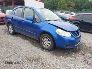 ✅ 2013 Suzuki SX4 LE • VIN: JS2YC5A32D6100013 • Lot: 42918706. Wystawiony na IAAI z przebiegiem 184 918 mil. Bezpłatny archiwum sprzedaży aukcyjnych z USA i szczegółowy raport historii pojazdu na DreamBid. Zdjęcie 1.