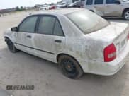 ✅ 2003 Mazda Protege DX • VIN: JM1BJ225730146488 • Lot: 42086747. Listed on IAAI with Not provided. Free auction sales archive from the USA and detailed vehicle history report at DreamBid. Image 3.