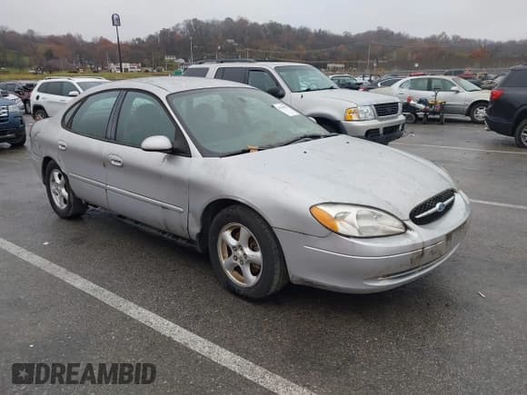 ✅ 2003 Ford Taurus SE Standard • VIN: 1FAFP53U13A216736 • Lot: 43728297. Listed on IAAI with 246,926 mi. Free auction sales archive from the USA and detailed vehicle history report at DreamBid. Image 1.
