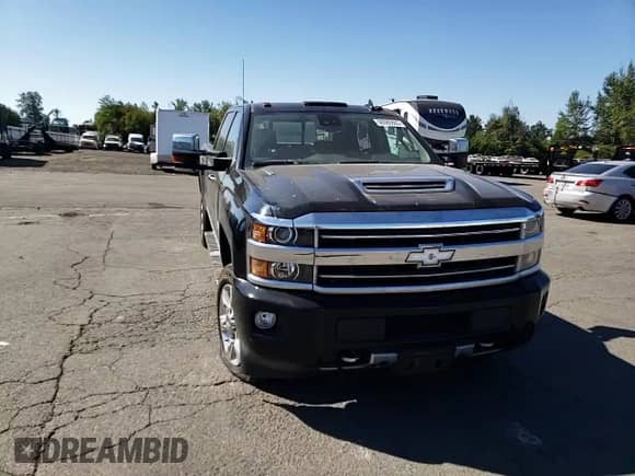 2018 Chevrolet Silverado 3500HD High Country с VIN 1GC4K1EY5JF153746, выставлен на аукционе Copart как лот 60980865 с пробегом Не указан миль и Списание • Salvage title. История ставок и продаж доступна на DreamBid. Изображение 13.