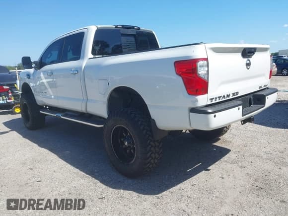 ✅ 2018 Nissan Titan Platinum Reserve • VIN: 1N6BA1F48JN519837 • Lot: 42063372. Listed on IAAI with 101,918 mi. Free auction sales archive from the USA and detailed vehicle history report at DreamBid. Image 3.